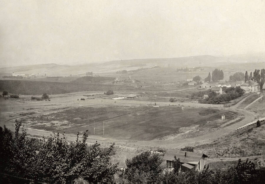 1920 photograph of MacLean Field. Houses to the right. [PG1_098-01]