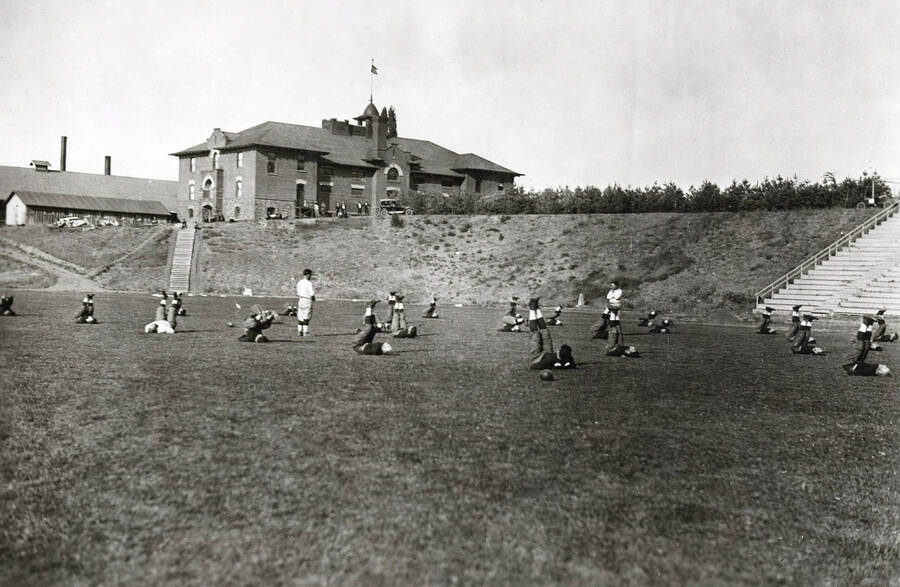 1923 photograph of MacLean Field. Student athletes on field. [PG1_098-07]
