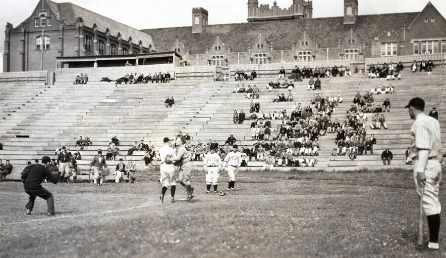 1923 photograph of MacLean Field. Baseball game in foreground, Administration Building in background. [PG1_098-08]