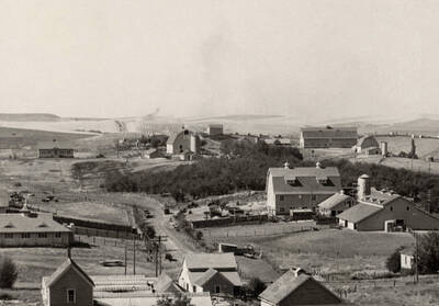 1939 panoramic photograph of University farms. Greenhouses are visible in the foreground.