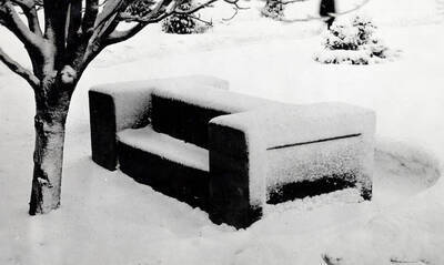 1950 photograph of the I Bench. The bench is covered in snow.