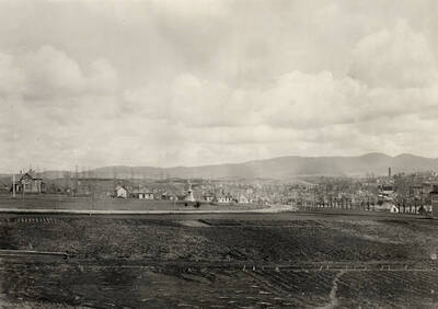 1900 photograph of University Farms. Spanish American War Memorial in background.