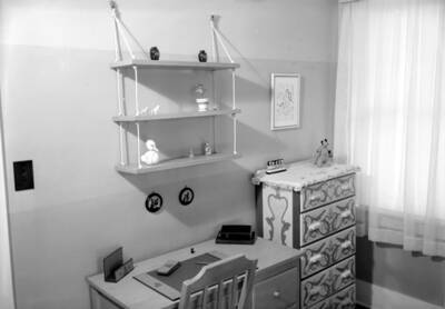 1945 photograph of the Home Management House. View of a bedroom.