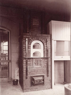 1928 photograph of Mines Building. Kiln in foreground.