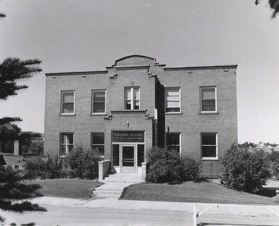 1945 photograph of Agronomy Building. Trees in foreground.