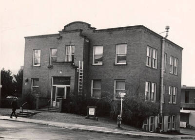 1945 photograph of Agronomy Building. A ladder is propped against the building entrance.