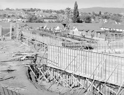 August 10, 1949 photograph of the Agricultural Science Building under construction. Construction workers in background.