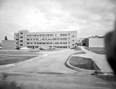 October 19, 1950 photograph of the Agricultural Science Building under construction. Automobiles in foreground.