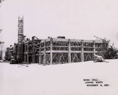 November 15, 1950 photograph of the Music Building under construction. Cannon in foreground.