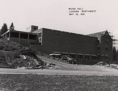 May 15, 1951 photograph of the Music Building under construction. Automobile in foreground.