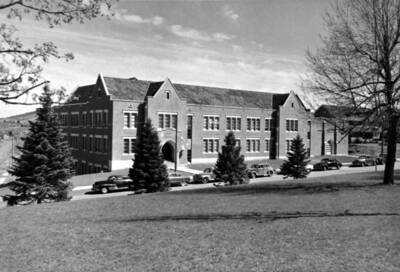 1960 photograph of the Music Building. Automobiles in foreground.