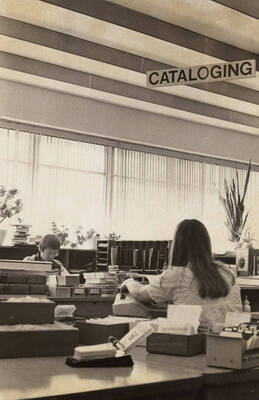 1978 photograph of the Library. Left to right: Henrietta Pew and Karen Eckert in the Technical Services department.