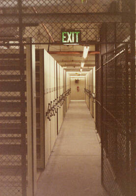 December 15, 1988 photograph of the Library. Compact shelving in basement. Donor: Monte Steiger.