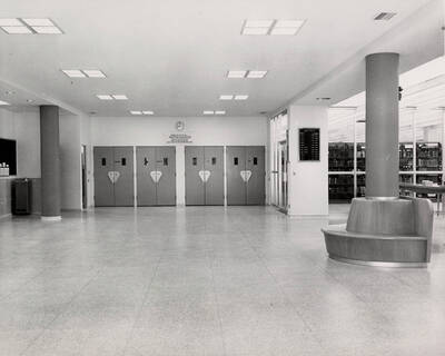 1957 photograph of the Library. Main lobby with stacks to the right.
