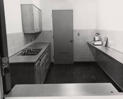 1957 photograph of the Library. A small kitchen on the ground floor is pictured.