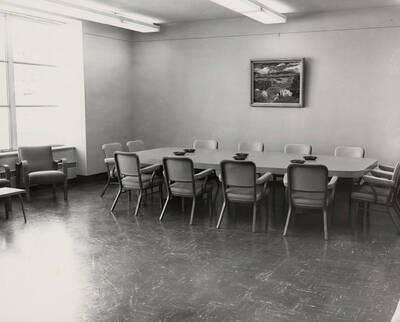 1957 photograph of the Library. Large conference room with ashtrays.