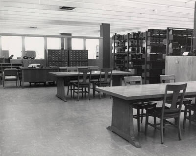 1957 photograph of the Library. Special Collections. Tables in foreground, card catalog in background.