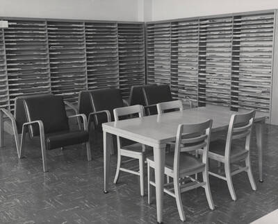 1957 photograph of the Library. Periodical shelves in background.