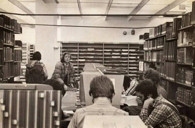 1978 photograph of the Library. Students study near the periodical shelves.