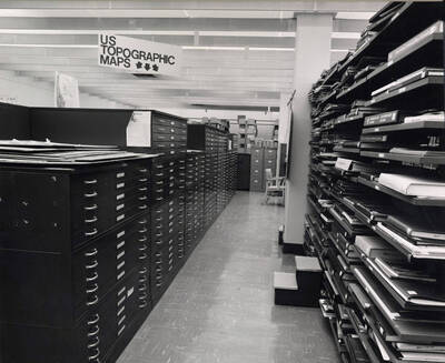 October 1, 1982 photograph of the Library. Map area with atlas shelves to the right.