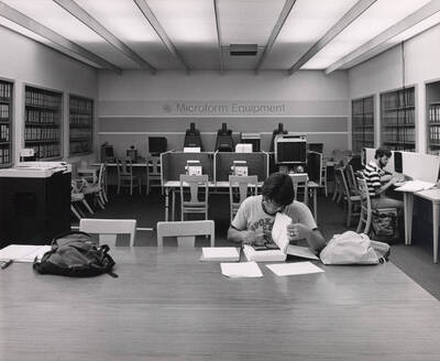October 1, 1982 photograph of the Library. Students study in the microform equipment area.