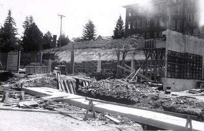 1960 photograph of the Mines Building under construction. Donor: College of Mines. Automobiles in background.
