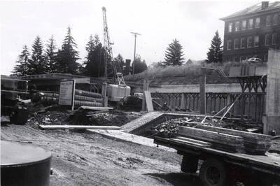 1960 photograph of the Mines Building under construction. Construction equipment in foreground. Donor: College of Mines.