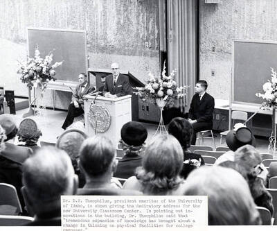 1965 photograph of the University Classroom Center dedication ceremony. D.R. Theophilus at lectern. Donor: Publications Dept.