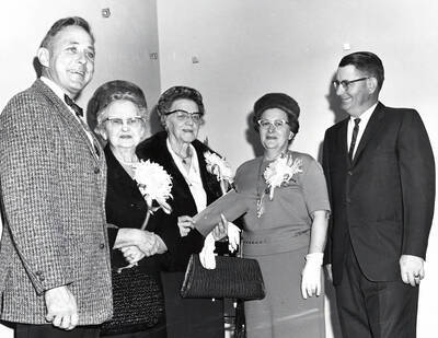 November 13, 1965 photograph of the dedication ceremony of the Willey Wing of the Wallace Residence Center. Left to right: E.W. Hartung, Mrs. J.E. Graham, Louise Carter, Mr. and Mrs. Harold Snow.