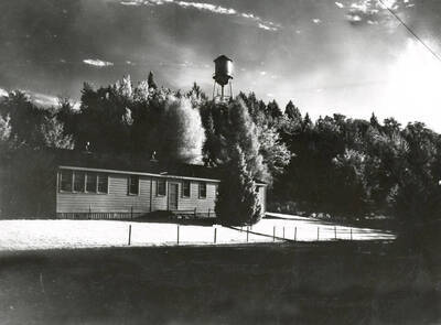 1952 photograph of the Communications (Radio-TV) Building. Water tower in background.