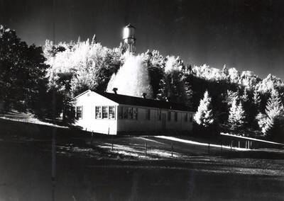 1952 photograph of the Communications (Radio-TV) Building. Water tower in background.