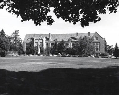 1956 photograph of Life Sciences Building. Automobiles in foreground. Donor: Publications Dept.