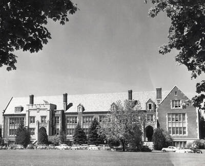 1956 photograph of Life Sciences Building. Automobiles in foreground.