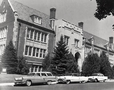1956 photograph of Life Sciences Building. Automobiles in foreground.