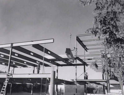 1968 photograph of the Education Building under construction. Construction workers in foreground.