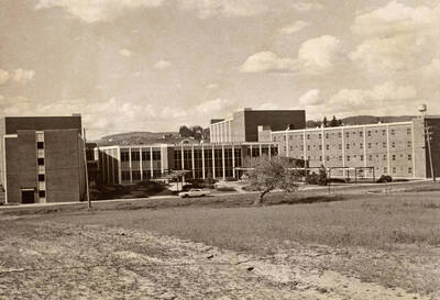 1968 photograph of the Wallace Residence Center. Automobile in foreground.
