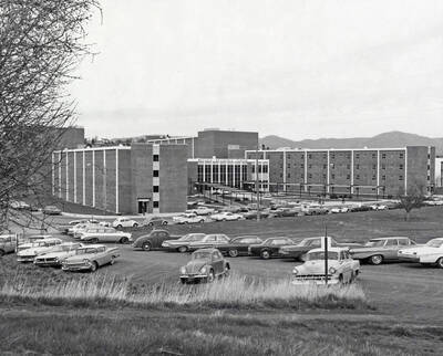 1963 photograph of the Wallace Residence Center. Automobiles in foreground. Donor: Publications Dept.