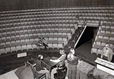 1975 photograph of Hartung Theatre. Students rehearse a play.