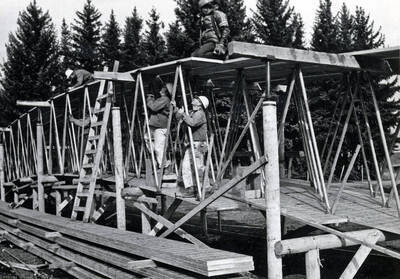 1975 photograph of the Kibbie-ASUI Activity Center under construction. Construction workers in foreground.
