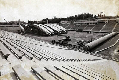1975 photograph of the Kibbie-ASUI Activity Center under construction. Construction equipment in foreground.