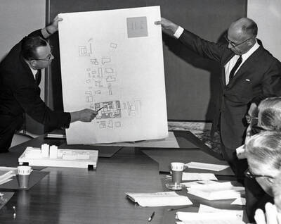 1966 photograph of George Gagon presenting plans for new dormitory complex to the Board of Regents. Donor: Publications Dept.