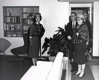 1965 photograph of the Home Management House. Left to right: Janet Latham, Head Resident, Mr. And Mrs. Elvin Hampton. Donor: Publications Dept.