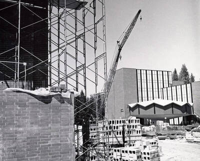1969 photograph of the Physical Education Building under construction. Education building in background.