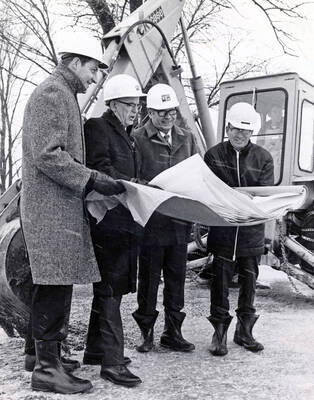 1972 photograph of the Menard Law Building under construction. Left to right: Douglas L. Grant, Albert R. Menard, H. Halverson, George Gagon.