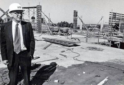 September 15, 1972 photograph of the Menard Law Building under construction. A.R. Menard in foreground.