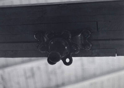 1975 photograph of Art and Architecture South. Detail of old gym hardware on roof beam. Donor: Karl Roenke.