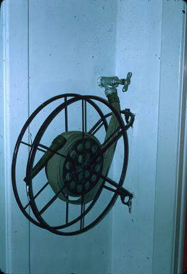 1975 photograph of Art and Architecture South during renovation. Detail of fire hose. Donor: Karl Roenke and Robert Weaver, 1976.