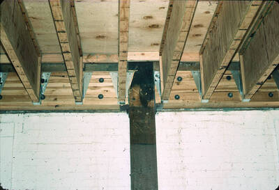 1975 photograph of Art and Architecture South during renovation. Detail of beam structure. Donor: Karl Roenke and Robert Weaver, 1976.