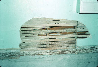 1975 photograph of Art and Architecture South during renovation. Detail of plaster lathing in basement. Donor: Karl Roenke and Robert Weaver, 1976.