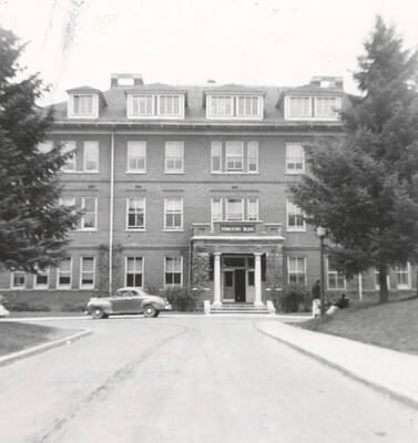 May 5, 1952 photograph of the Forestry Building. Automobile in foreground. Donor: Gary Cox.